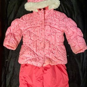 Pink snowsuit with little hearts in good condition